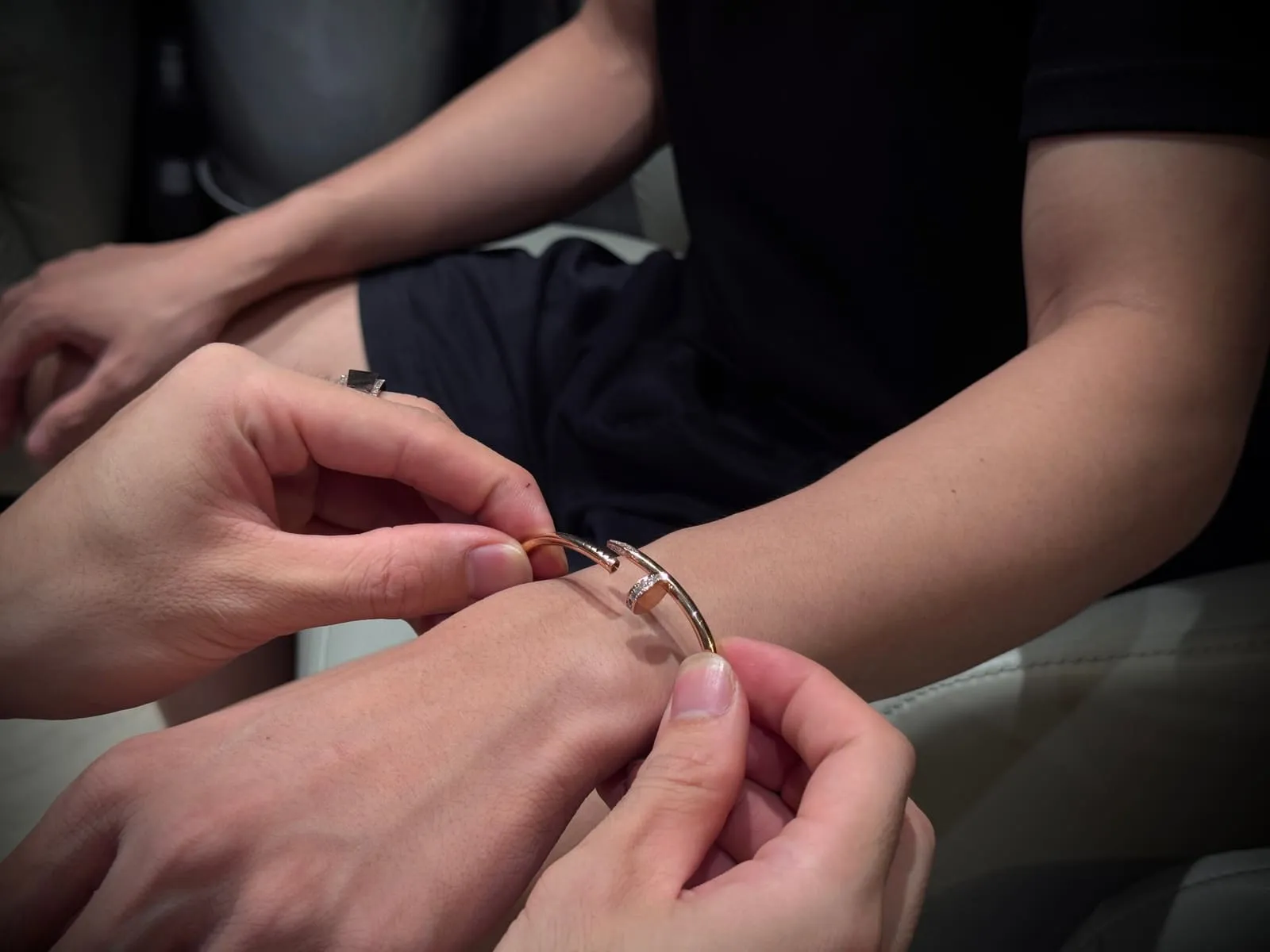 A T&nbsp;Gold specialist fitting a bracelet