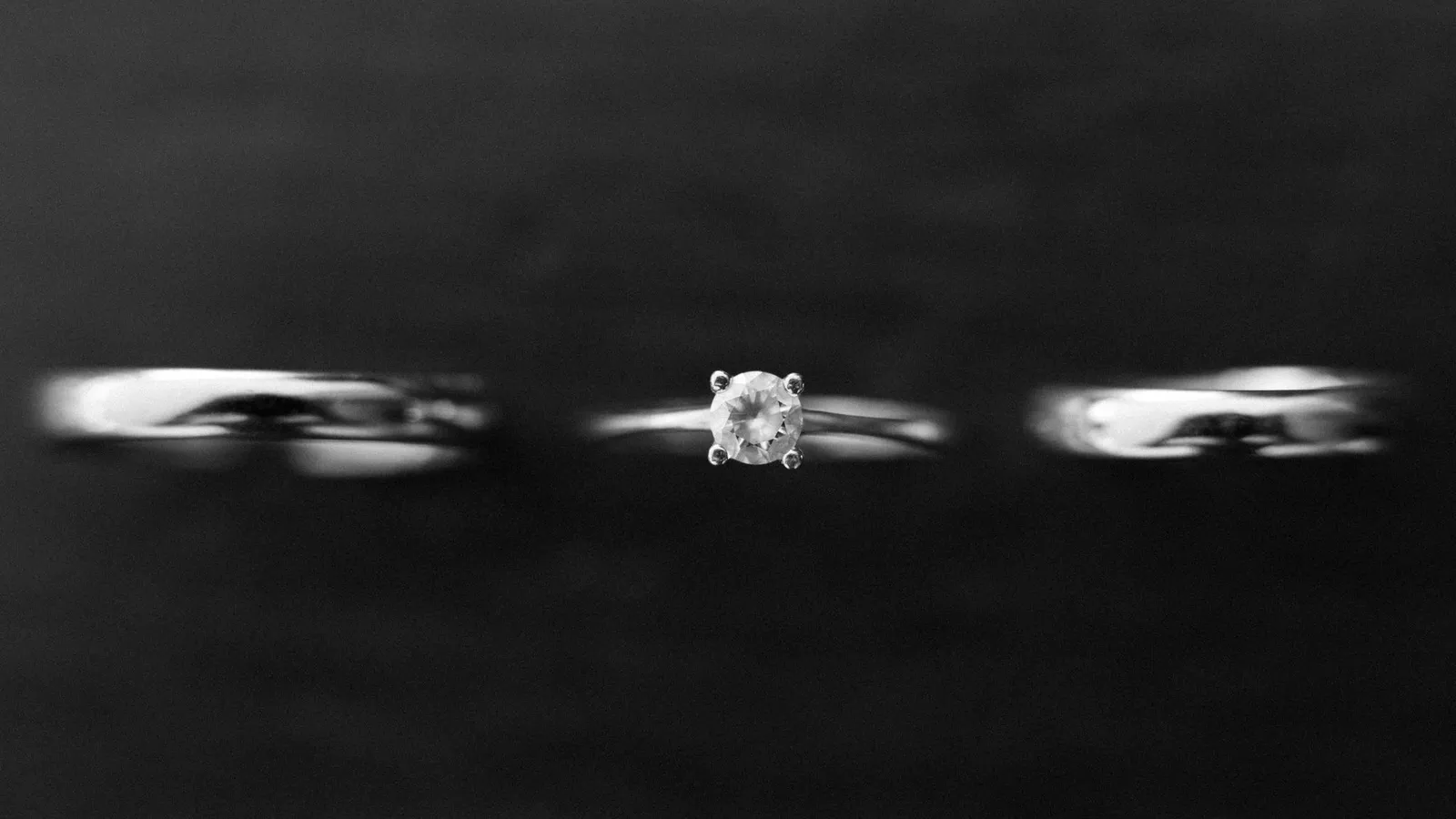 A solitaire ring between two plain bands